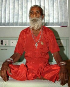 HUMAN MIRACLE: Prahlad Jani sits on a bed at Sterling hospital in Ahmedabad on Nov. 22, 2003. Scientific examinations have shown that yoga exercises have transformed his body.
